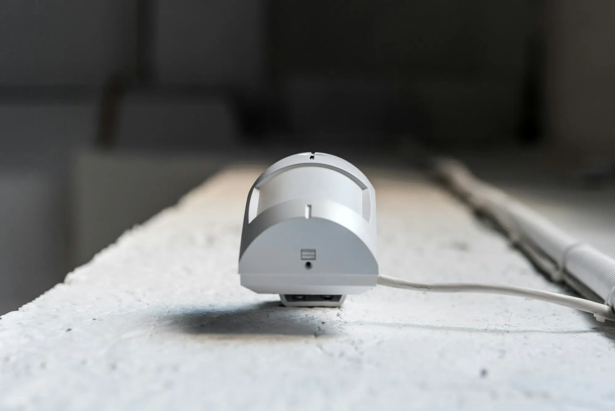 Bottom View Of One Motion Sensor On White Wall