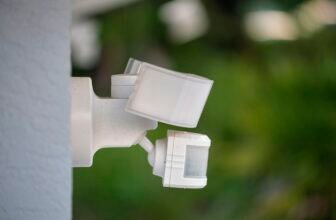 Motion Sensor With Light Detector Mounted On Exterior Wall Of Private House